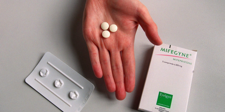 PARIS, FRANCE:  A nurse shows the RU486 pill at the family planning department of Hopital Broussais, 25 October 2000. (Photo credit should read MANOOCHER DEGHATI/AFP/Getty Images)