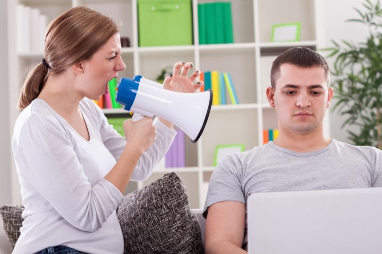 wife yelling at husband with lap top