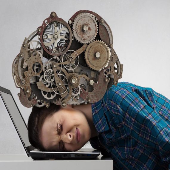 Stressed woman with head under pressure of mechanism