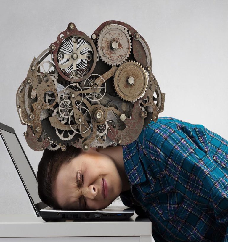 Stressed woman with head under pressure of mechanism