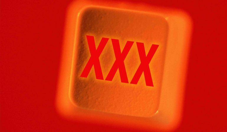 "XXX" on Computer Key --- Image by © Randall Fung/Corbis
